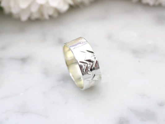 Mountain ring made of recycled silver.