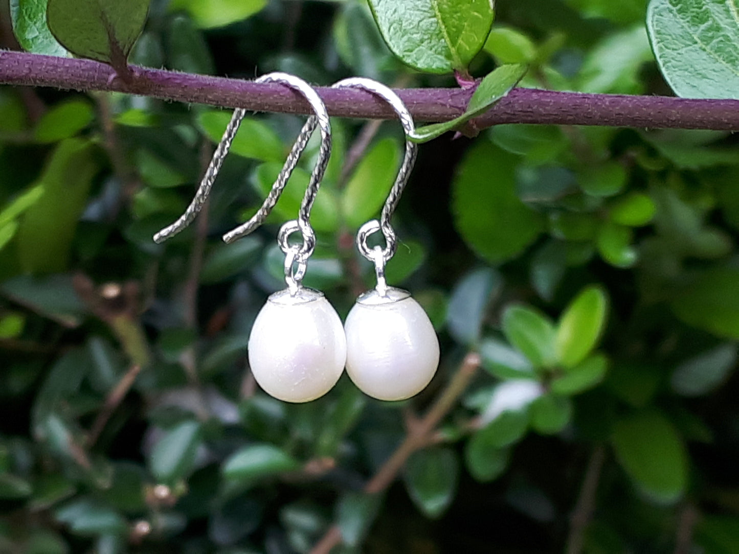 Silver and pearl drop earrings.