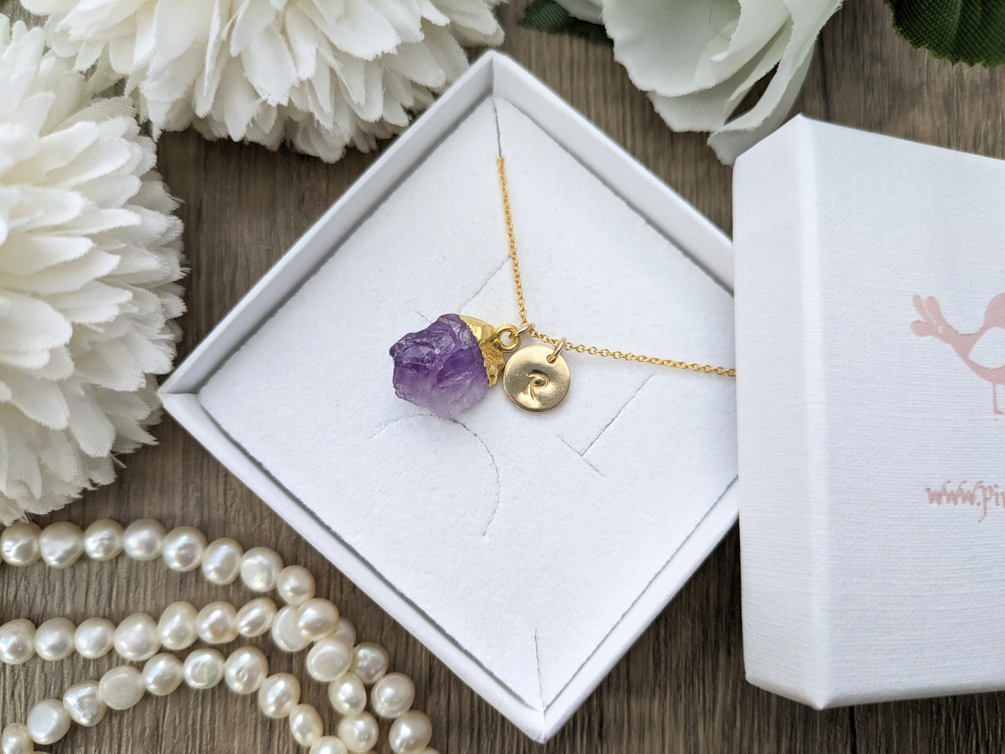 Amethyst initial necklace in gold.