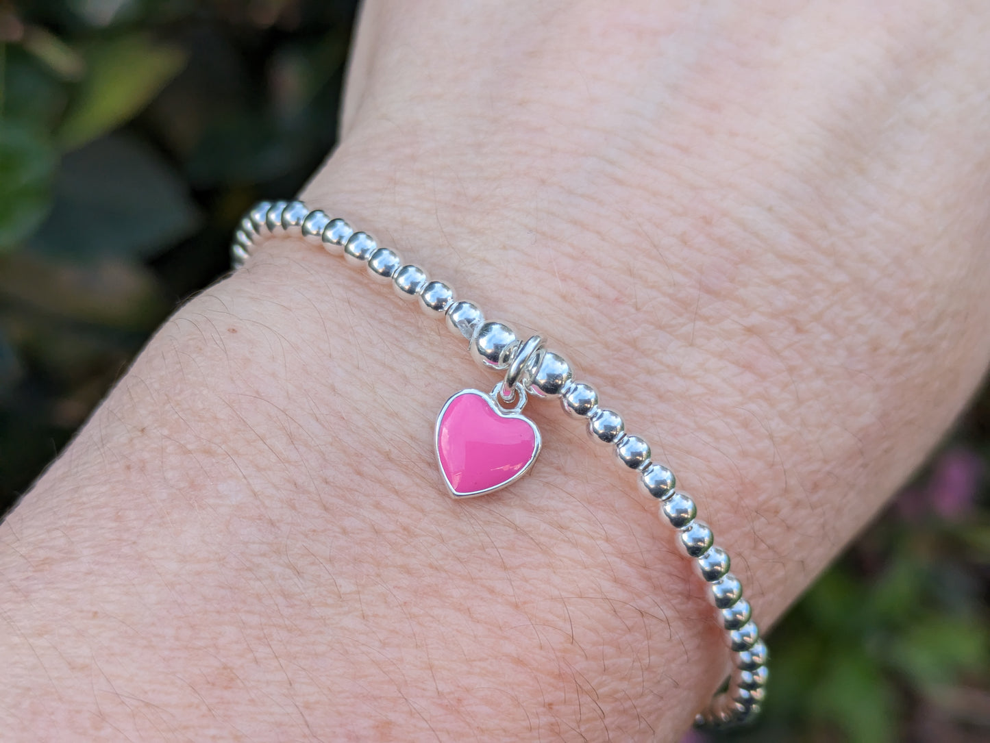 Pink heart charm bead bracelet.