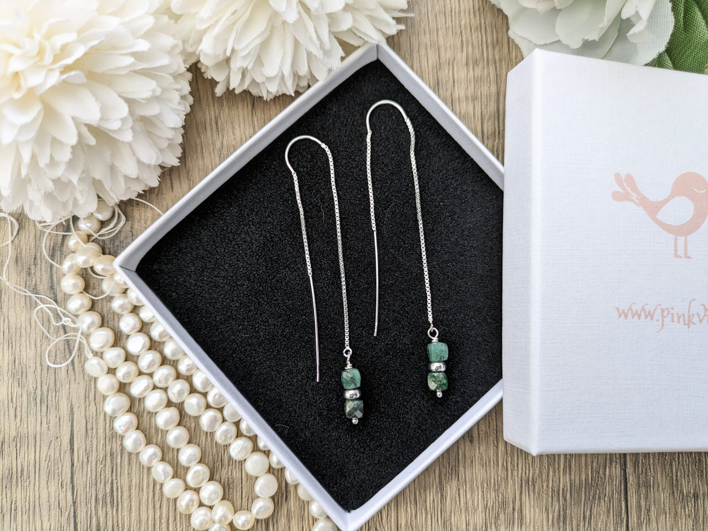 Emerald threader earrings.