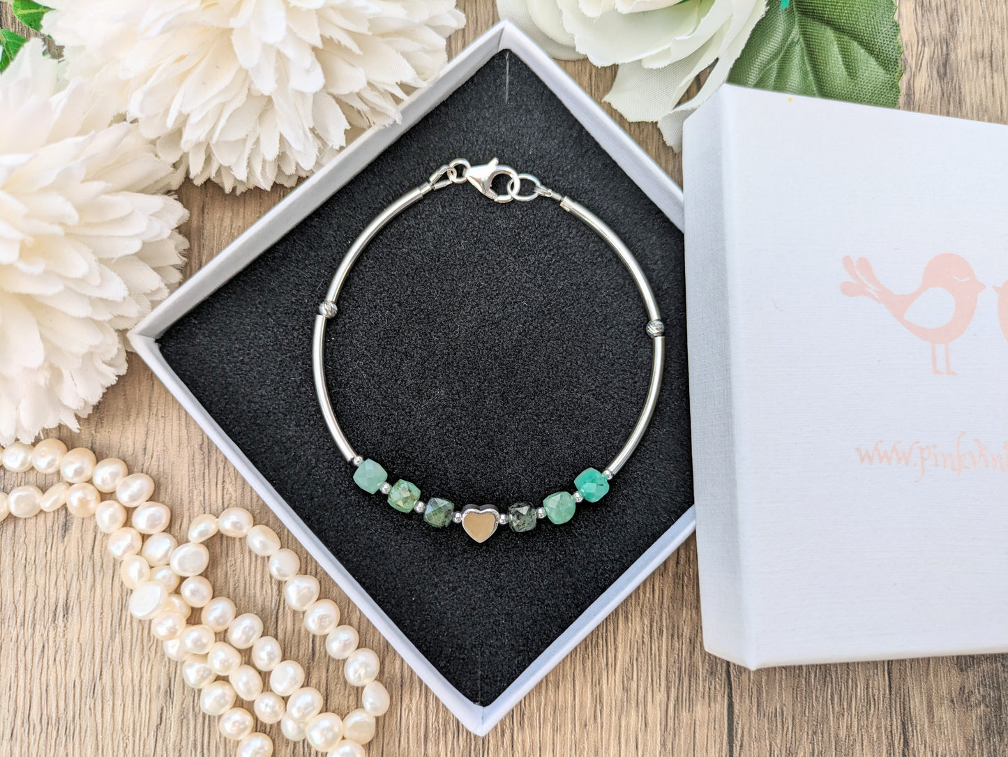 Personalised emerald bracelet in sterling silver.