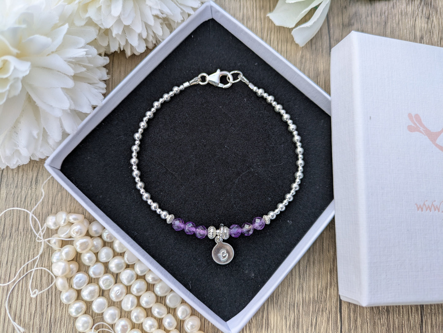 Amethyst gemstone initial bracelet in silver.