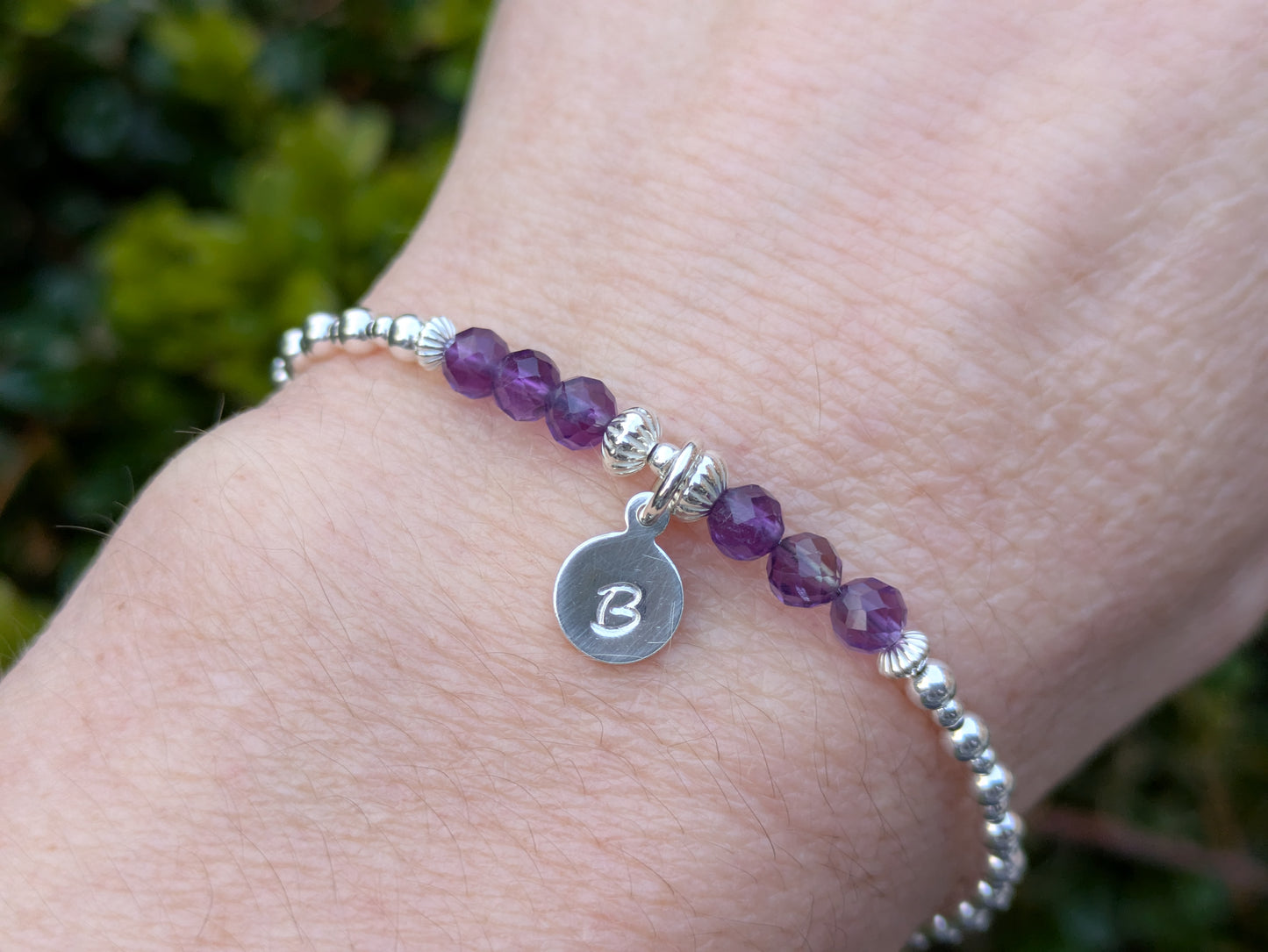 Amethyst gemstone initial bracelet in silver.