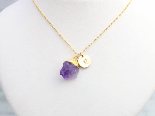 Amethyst initial necklace in gold.