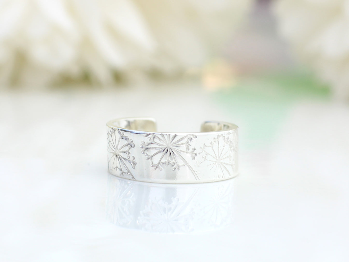 Dandelion ear cuff made with recycled silver.