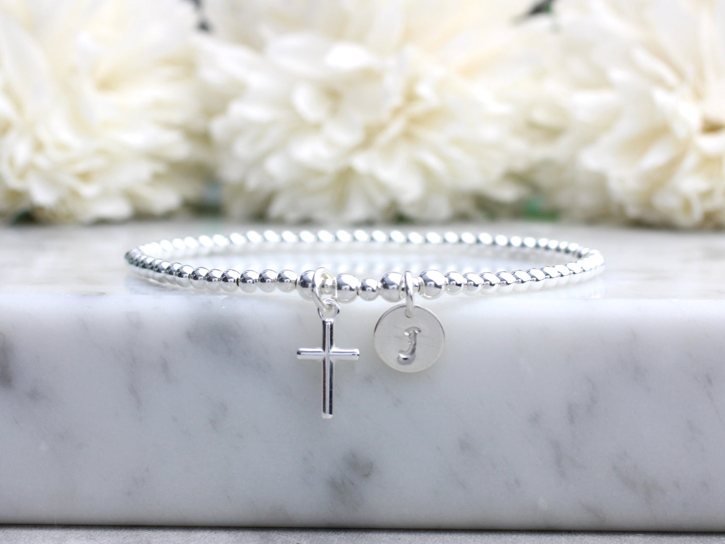 cross charm bracelet