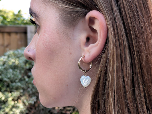 gold hoop earrings with mother of pearl heart
