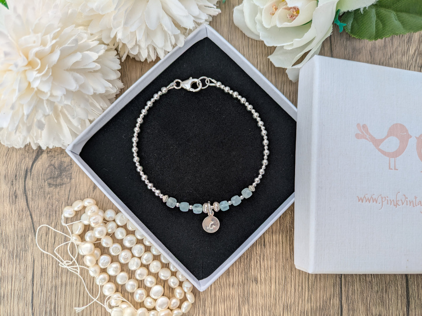 Aquamarine initial gemstone bracelet in silver.