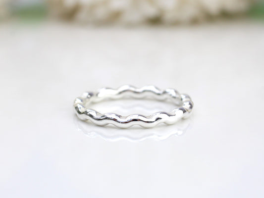 Wavy ring made from recycled sterling silver.