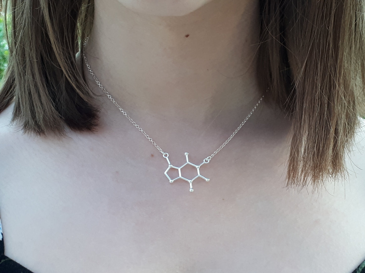 Caffeine molecule necklace.