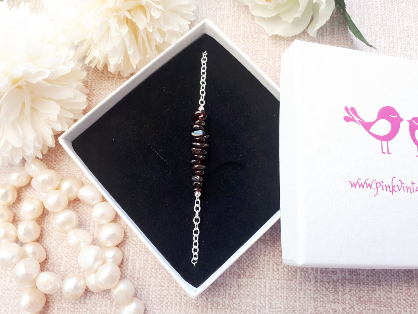 Garnet adjustable bracelet in sterling silver.