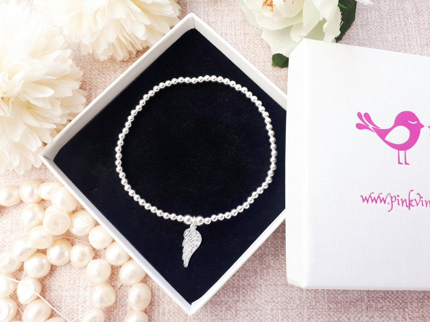 Sterling silver angel wing stretch bracelet.