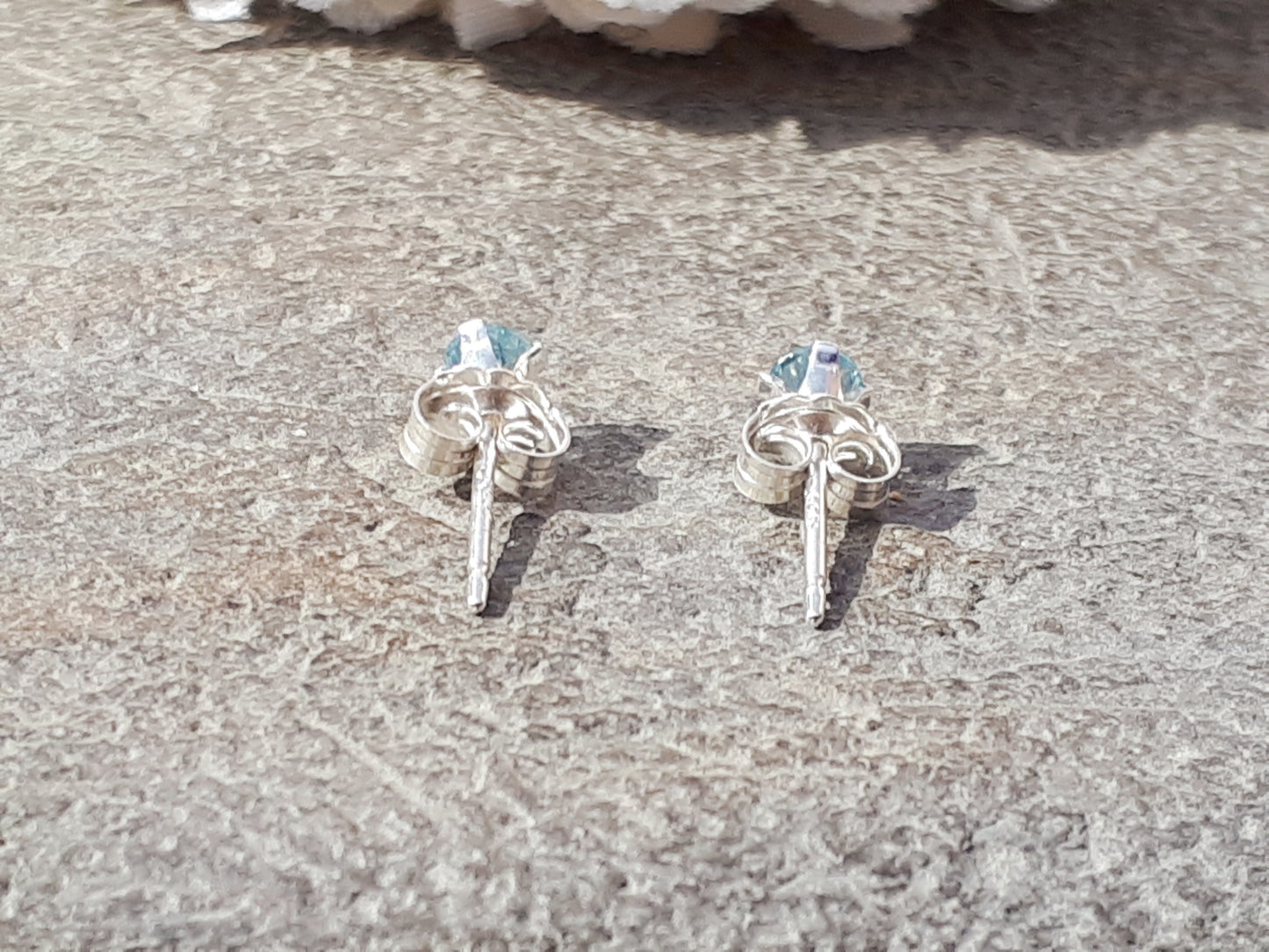 Aquamarine stud earrings in silver or gold.