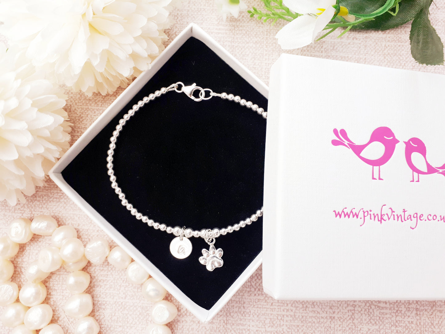 Paw print and initial charm bracelet.