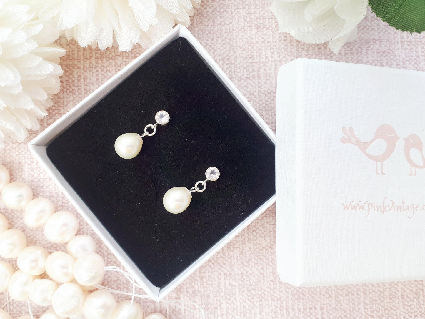 Rose quartz and pearl earrings.