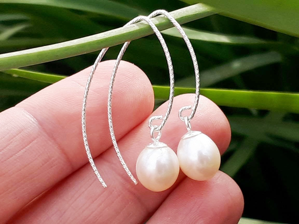 Freshwater pearl drop earrings in silver or gold.