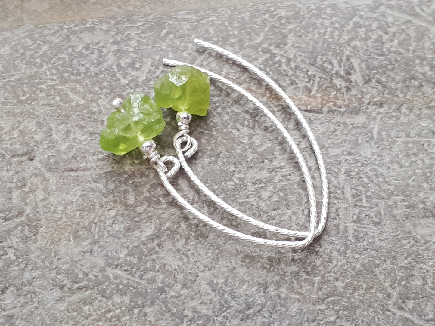 Raw peridot earrings in sterling silver.