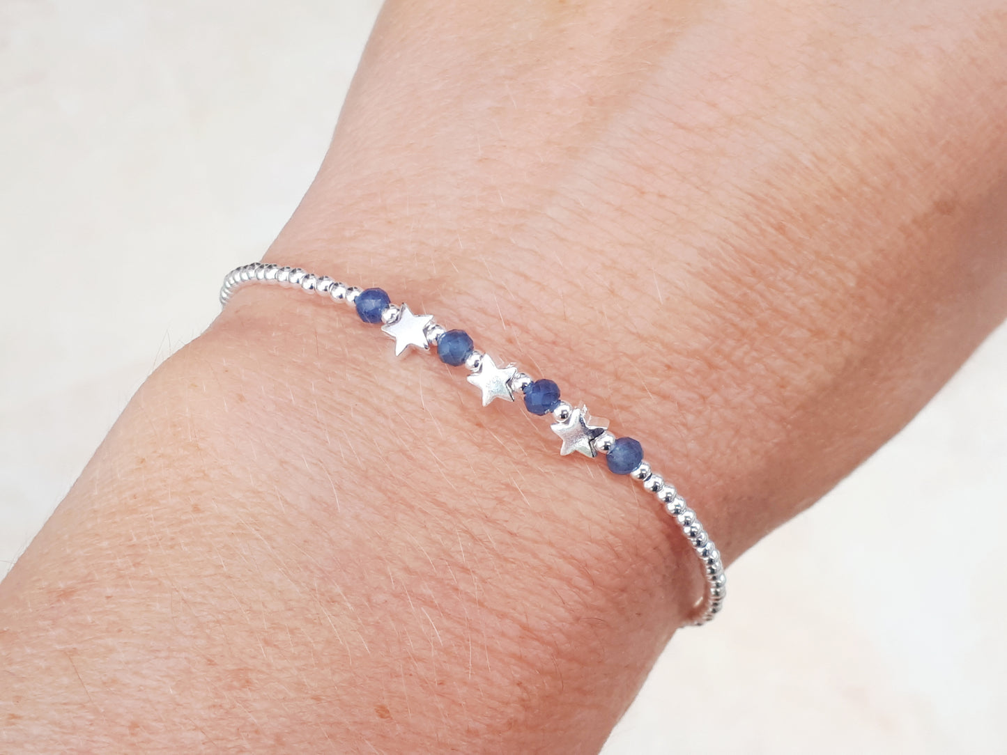 Sapphire bracelet sterling silver with optional personalised initial tag. September birthstone bracelet.