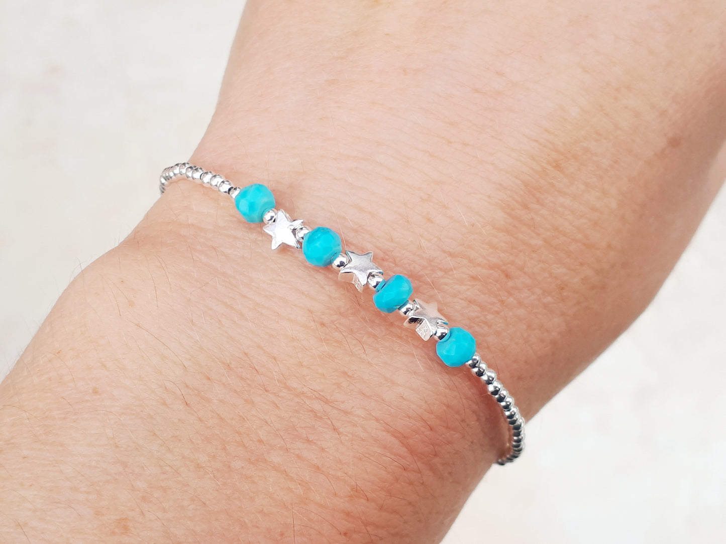 Star bracelet with turquoise gemstones.