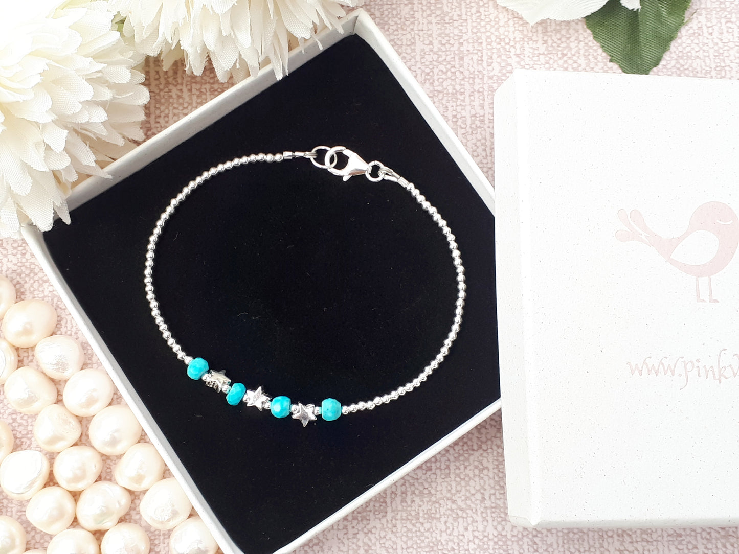 Star bracelet with turquoise gemstones.