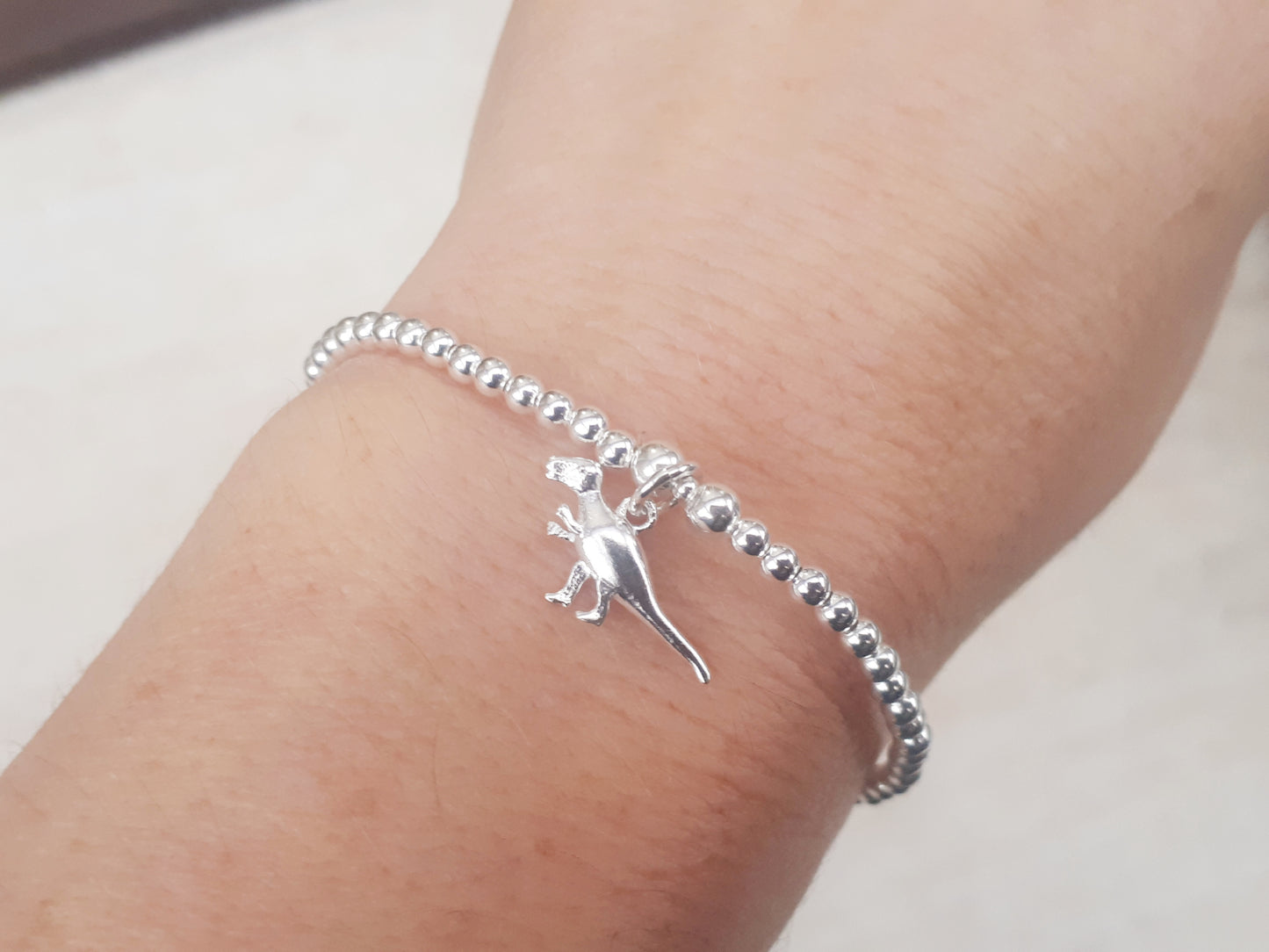 T rex charm bracelet.