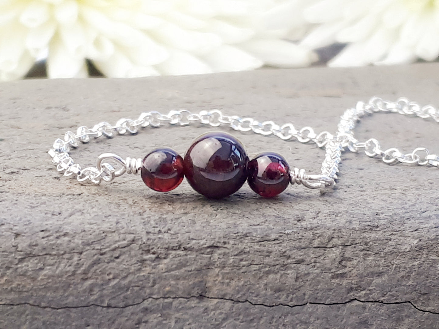 Garnet ankle bracelet in sterling silver.