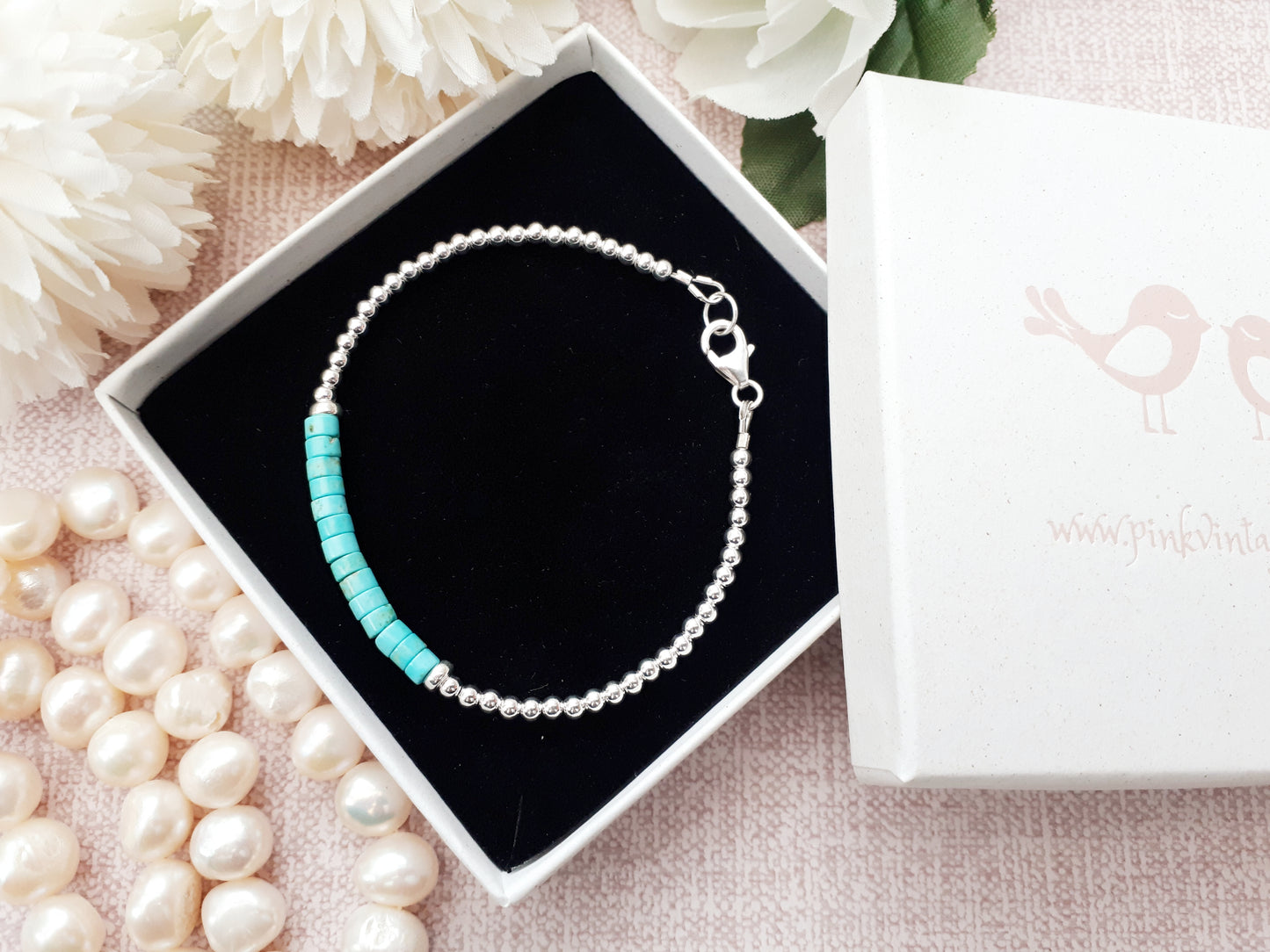 Turquoise heishi bead bracelet in sterling silver.