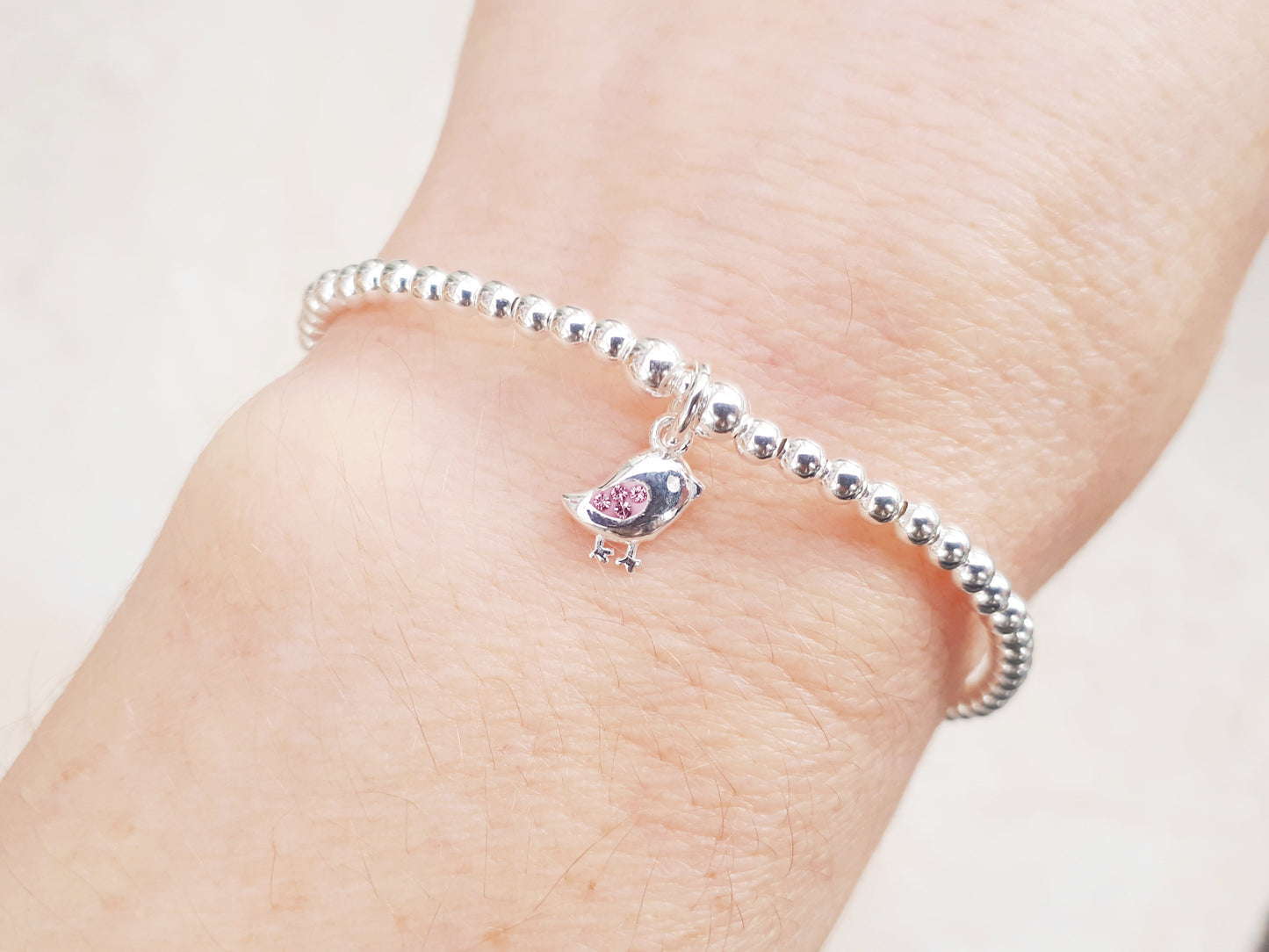 Bird charm bracelet.