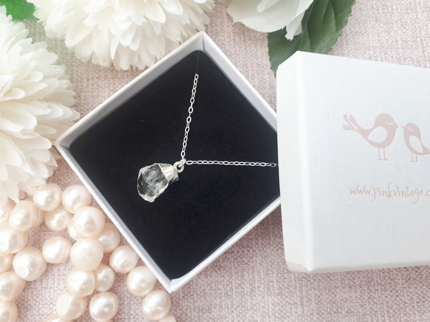 Raw crystal quartz necklace in sterling silver.