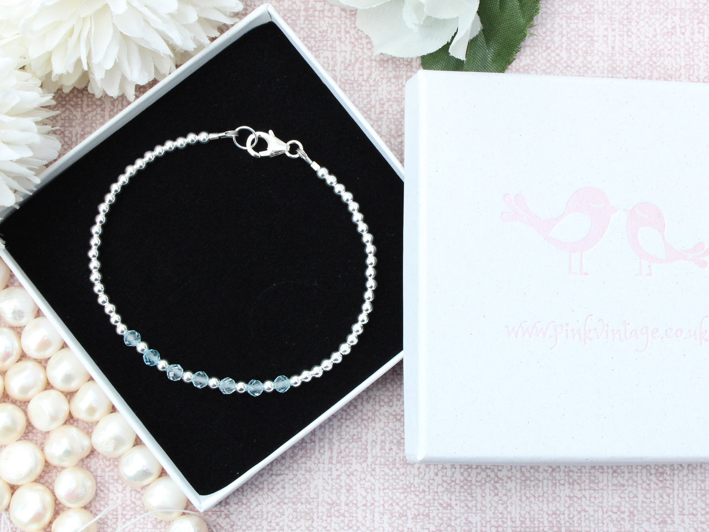 Blue topaz milestone bracelet in silver.