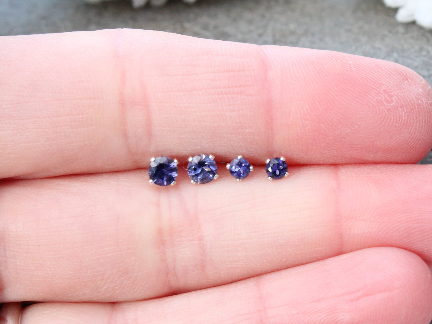 Iolite stud earrings in sterling silver or gold.