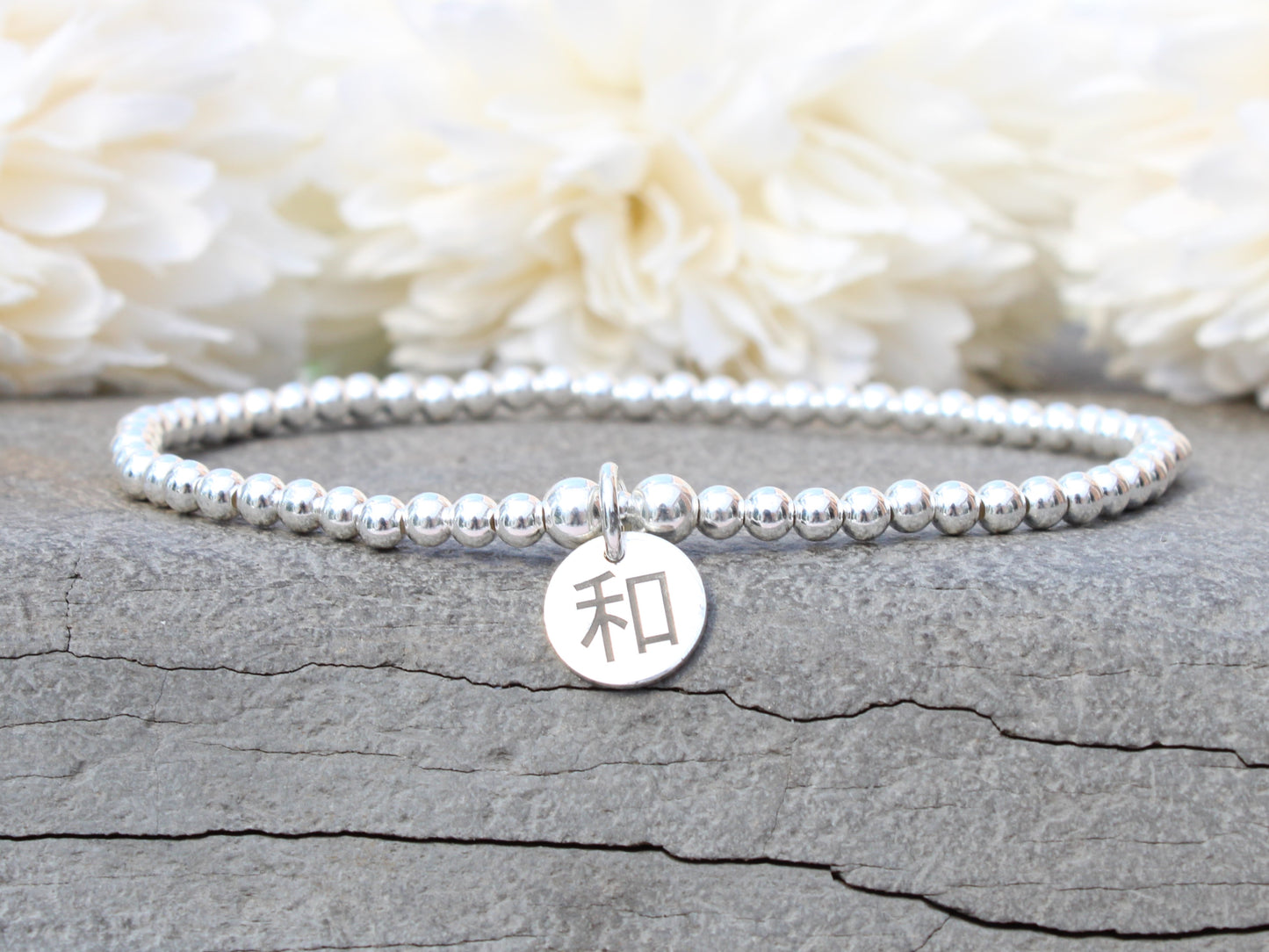 Sterling silver peace and harmony chinese symbol bracelet.