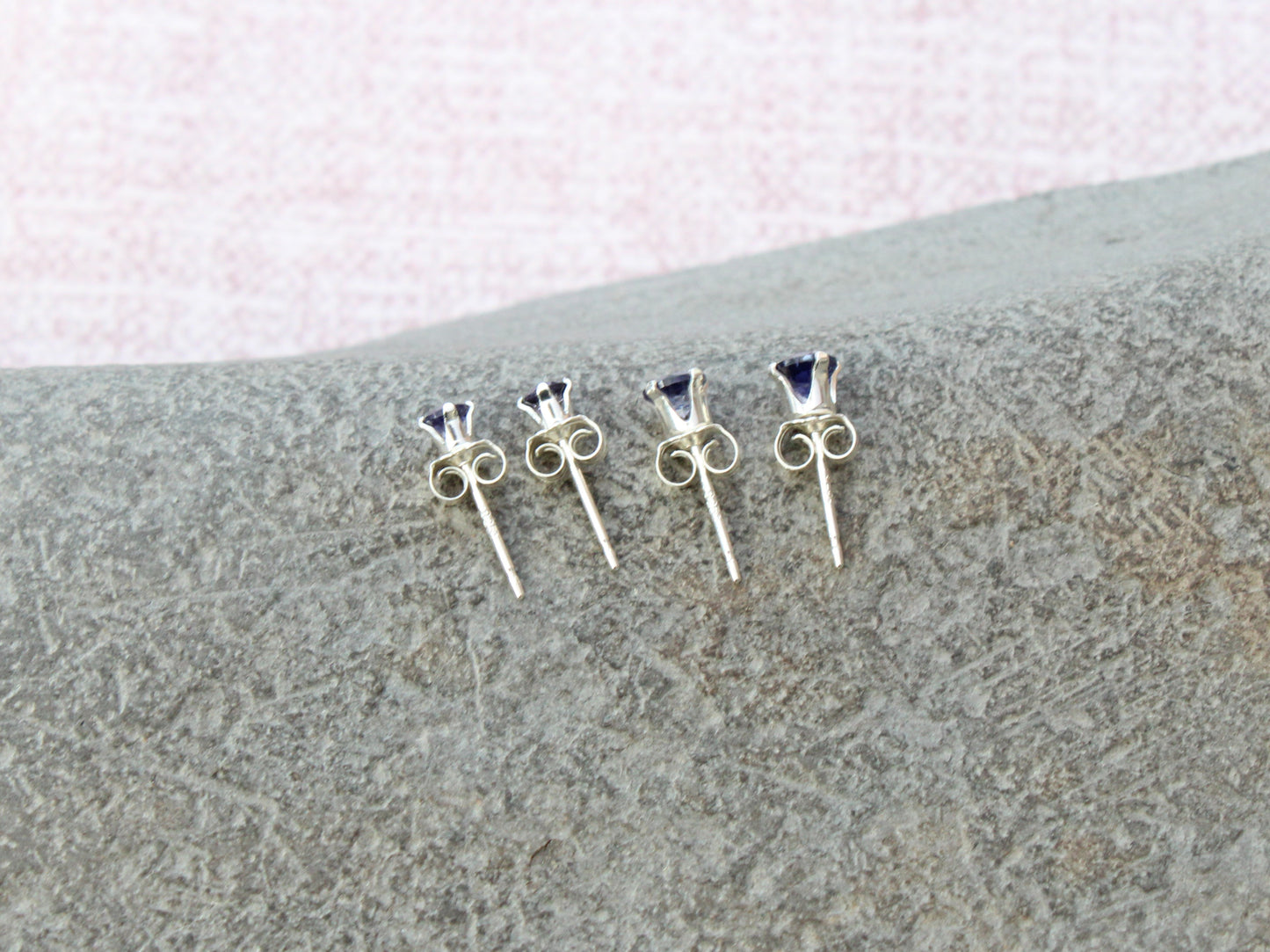 Iolite stud earrings in sterling silver or gold.