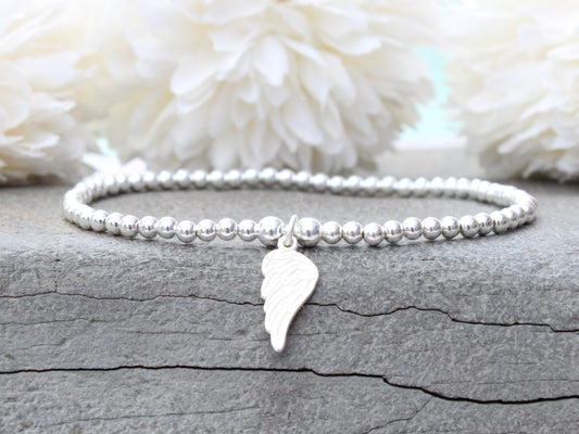 Sterling silver angel wing stretch bracelet.