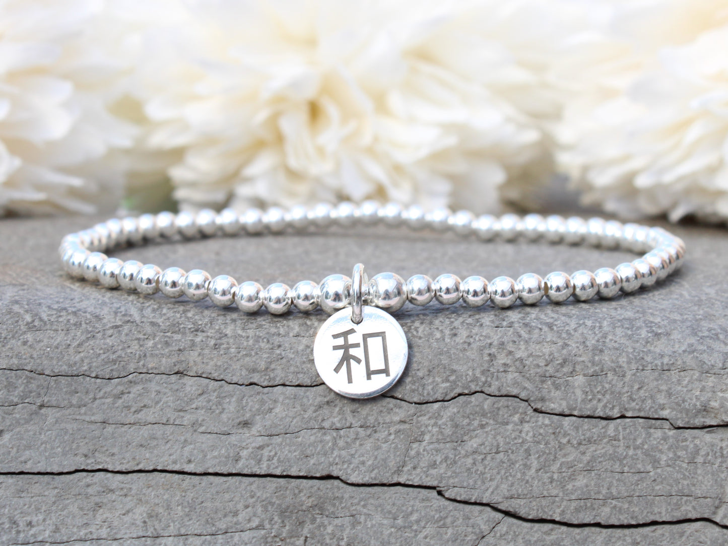 Sterling silver peace and harmony chinese symbol bracelet.