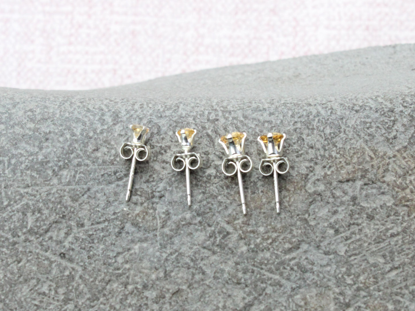 Citrine stud earrings in sterling silver or gold.