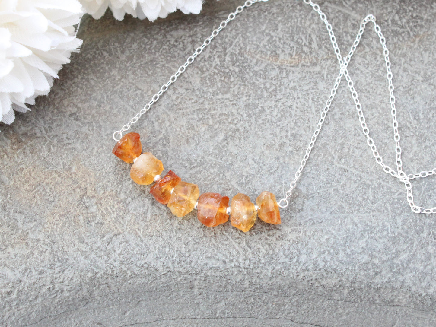 Raw citrine gemstone necklace in silver.