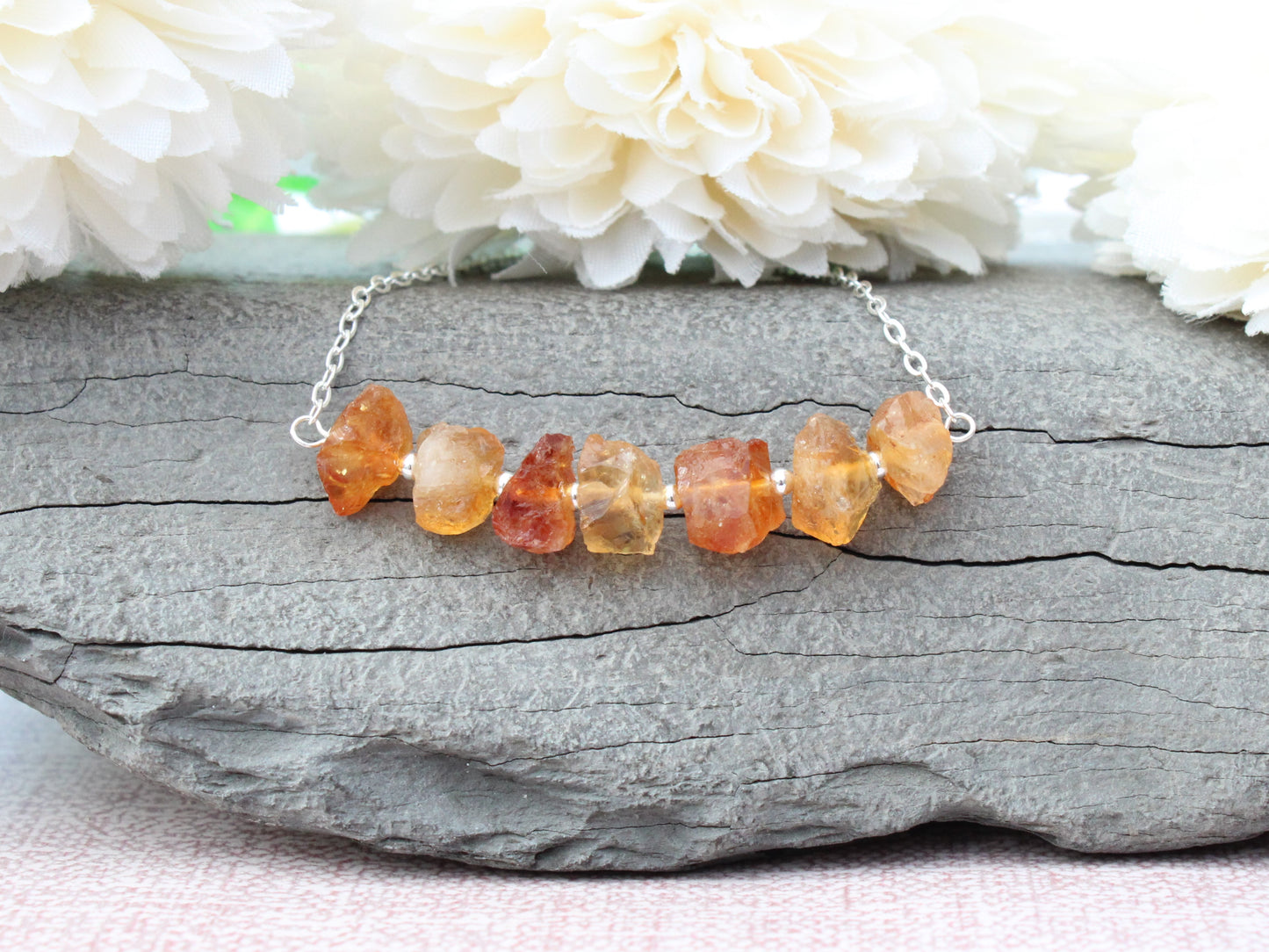 Raw citrine gemstone necklace in silver.