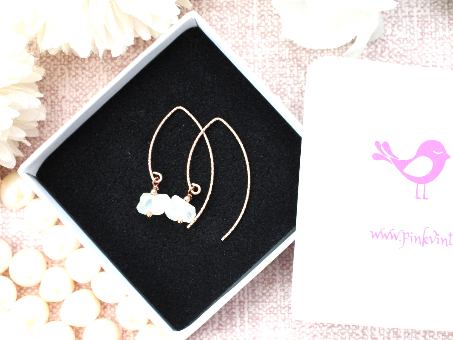 Raw moonstone earrings in gold.