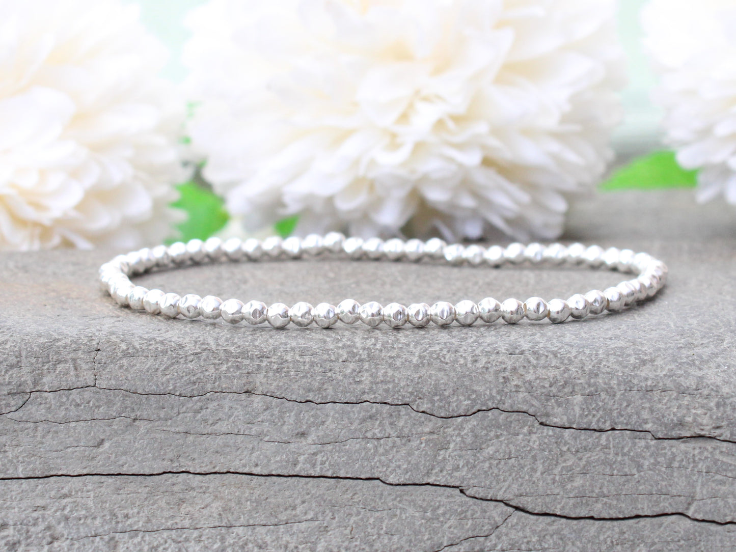 Sterling silver hammered bead bracelet.
