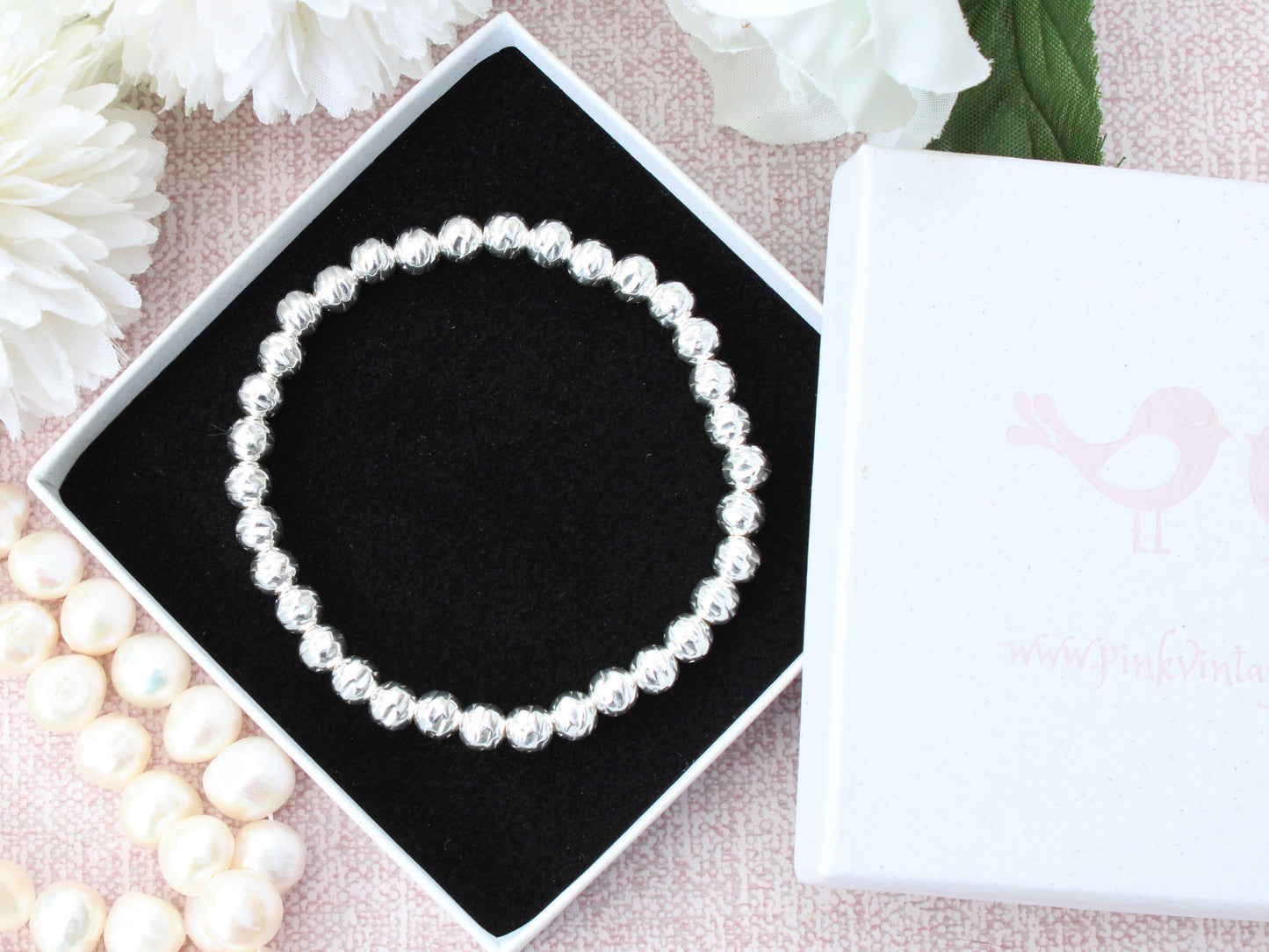 Sterling silver hammered bead bracelet.