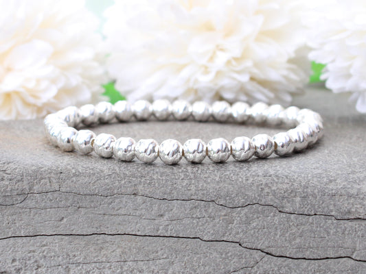 Sterling silver hammered bead bracelet.