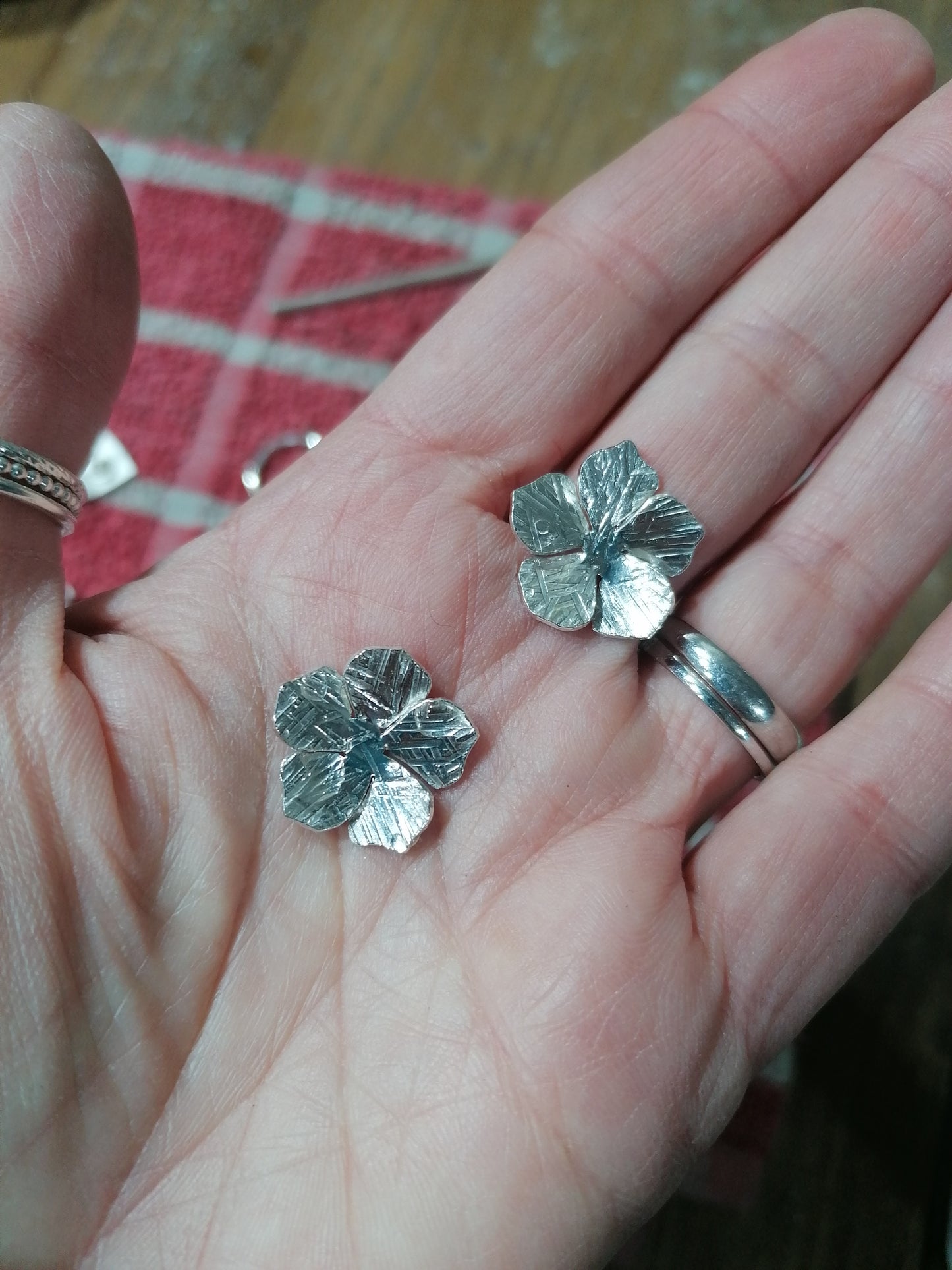 Flower drop earrings in sterling silver.