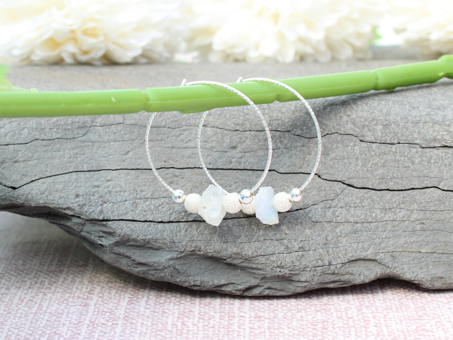 Raw moonstone hoop earrings in sterling silver.