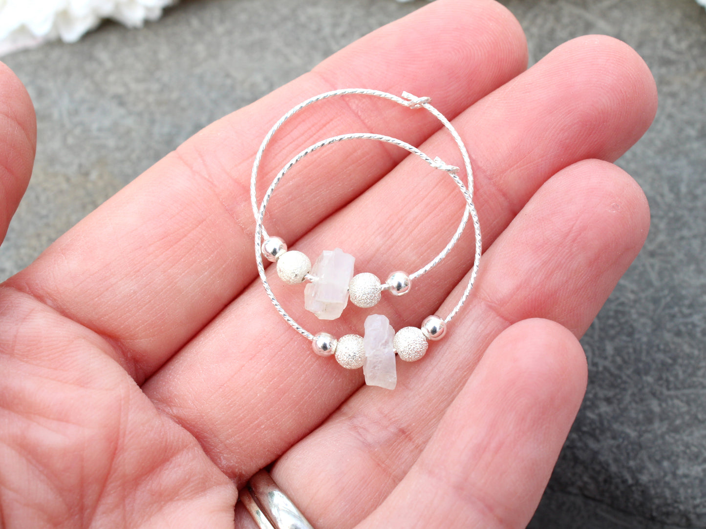 Raw moonstone hoop earrings in sterling silver.