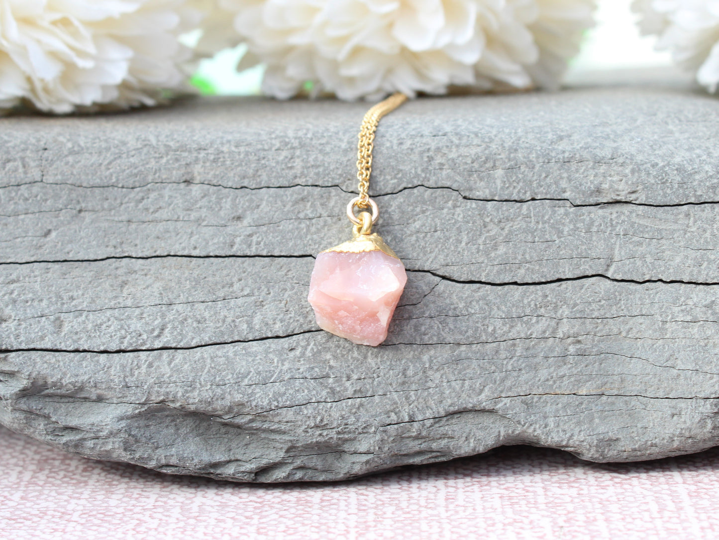 Raw pink opal necklace in gold.