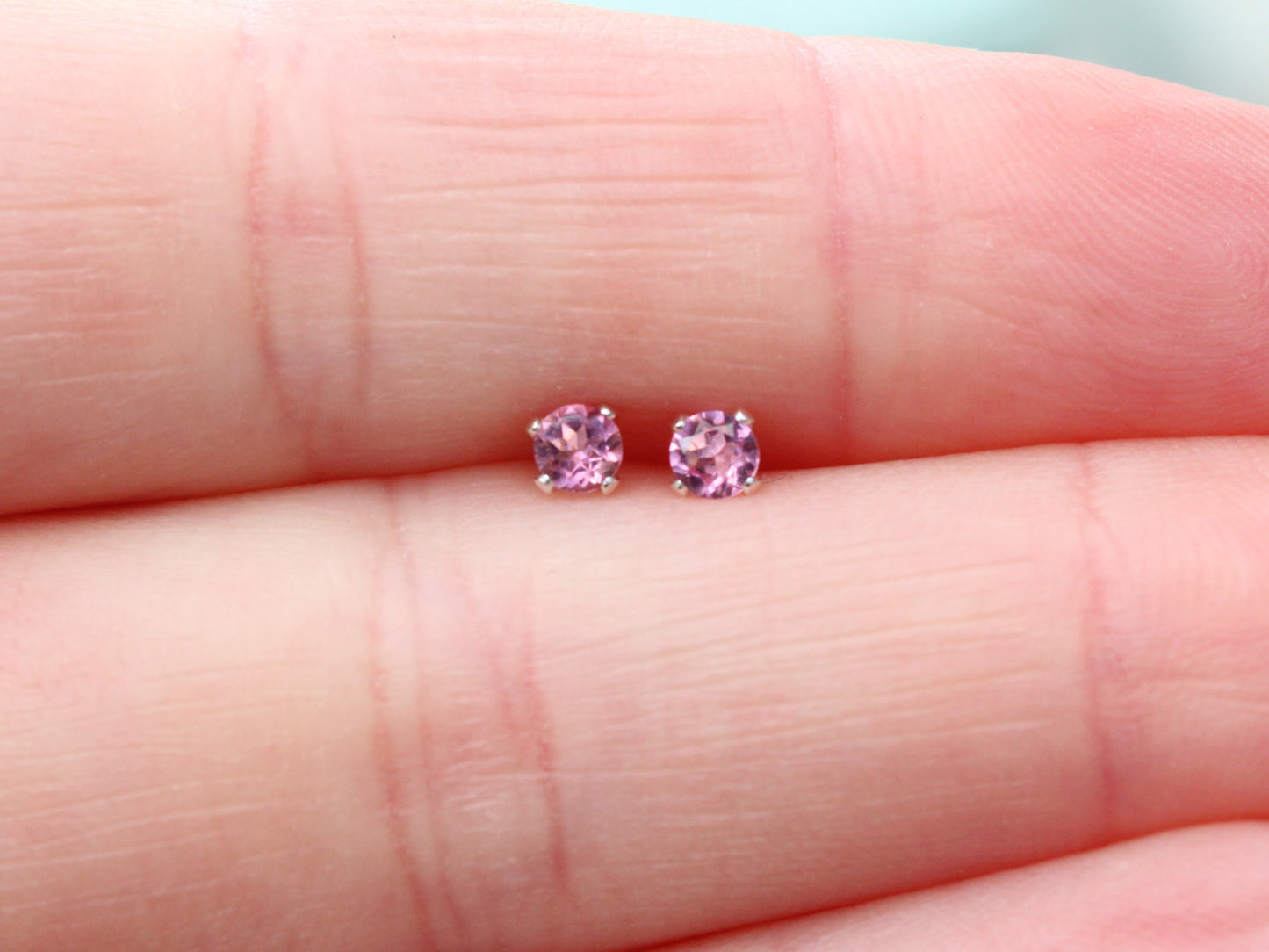 Pink tourmaline stud earrings in silver or gold.
