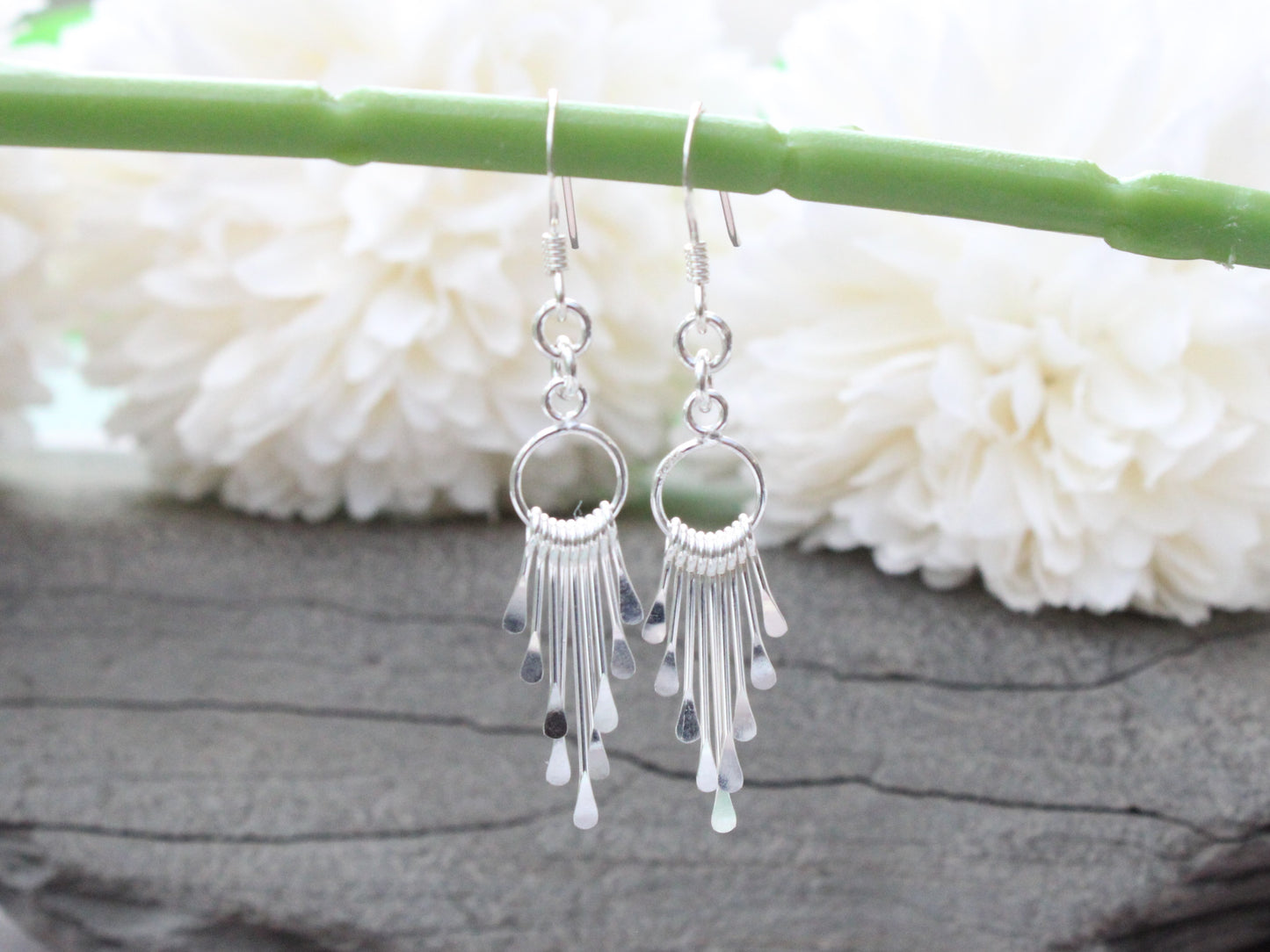 Silver tassel earrings.