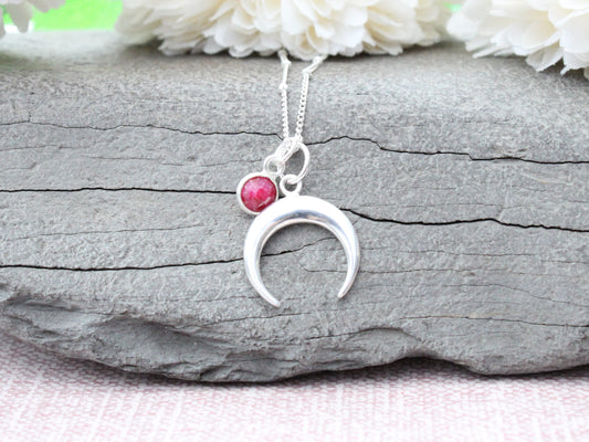 Crescent moon necklace in sterling silver.